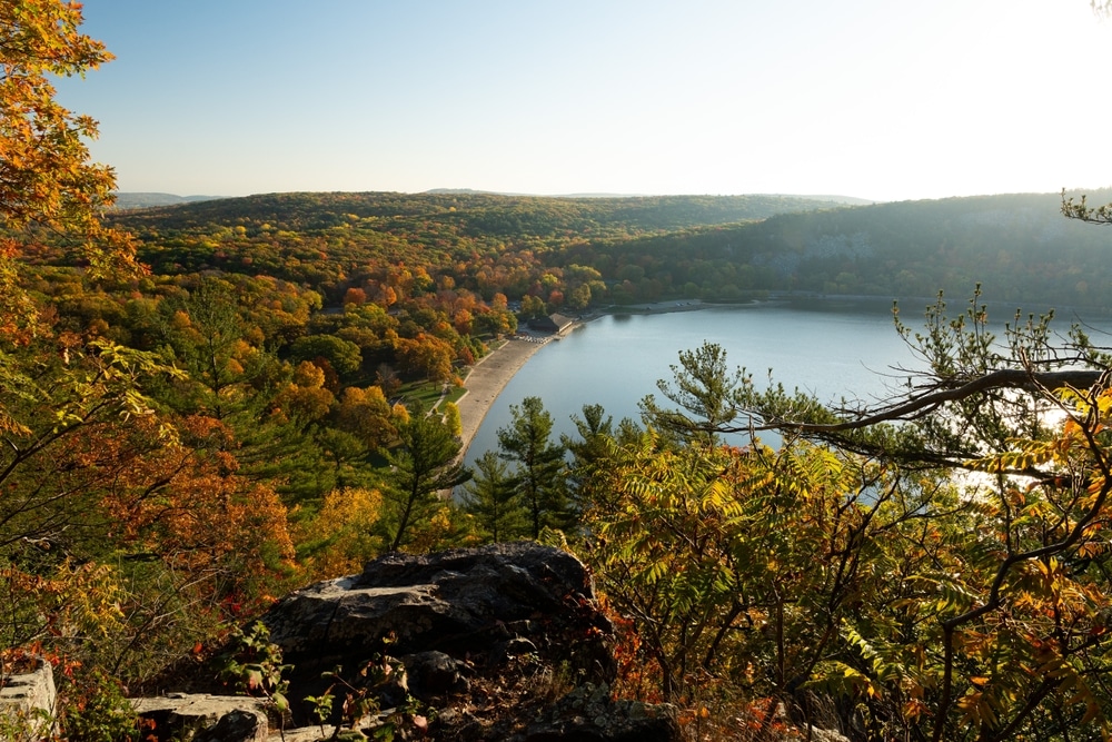 The fall colors in Wisconsin are showing themselves! Image of Devils Lake State Park with fall foliage surrounding it.