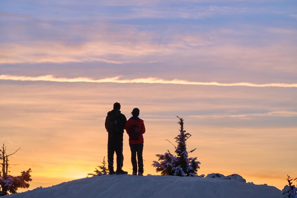 Couple snowshoeing and taking in the view over Parfrey's Glen near our Bed and Breakfast in Wisconsin
