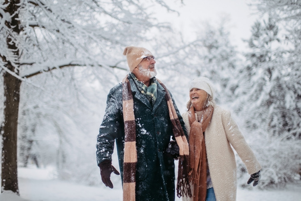 Couple enjoying a snowing winter wonderland at our Bed and Breakfast Wisconsin