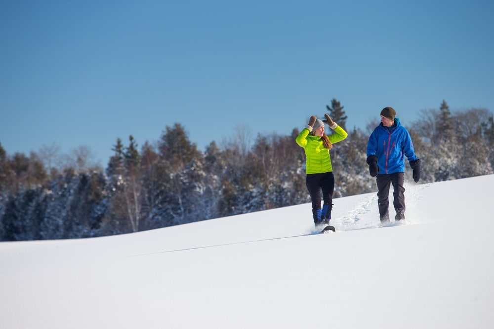 Couple coming back to the Inn after a snowshoeing adventure at Parfrey's Glen in Wisconsin